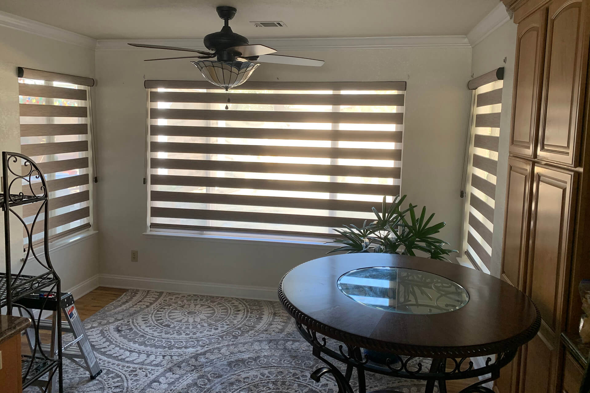 A loft with open dual shades on every window.